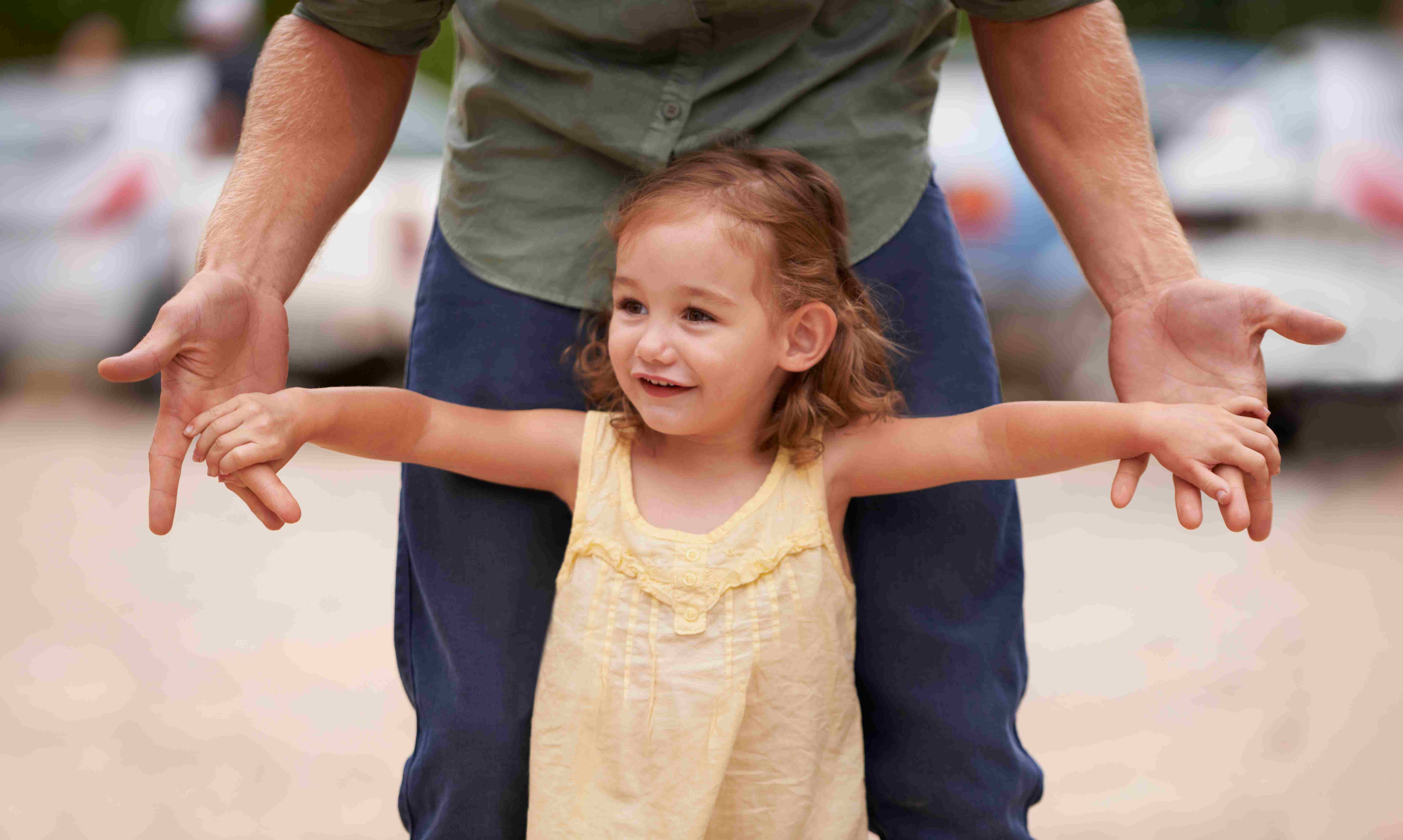 Child playing with father