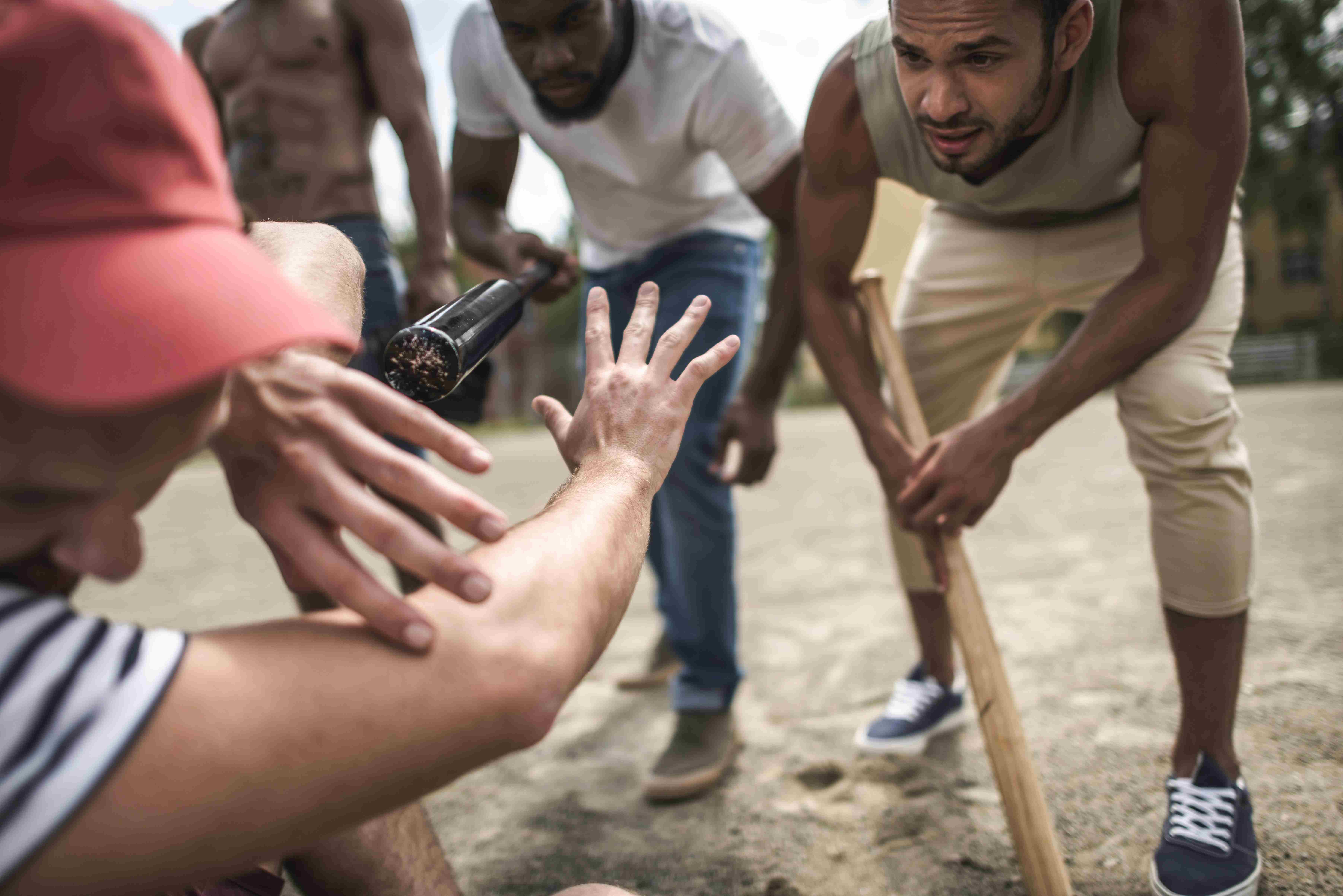Group of men intimidating an individual